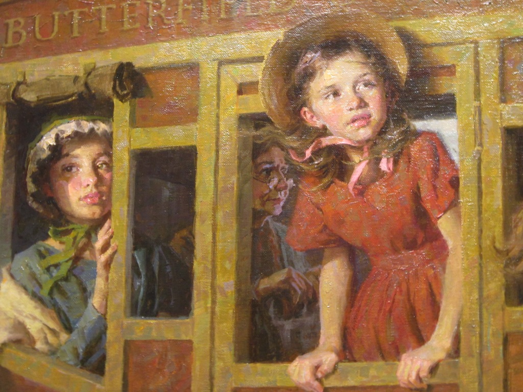 a close-up of the Stagecoach Journey showing two girls and an older woman inside the stagecoach
